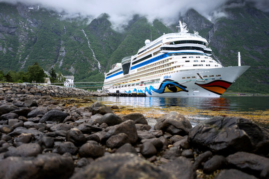 EIDFJORD, NORWAY - June 11, 2017: AIDAsol at Eidfjord Cruise Terminal. AIDAsol is a Sphinx class cruise ship, built at Meyer Werft for AIDA Cruises, one of ten brands owned by Carnival Corp.