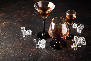 Set of strong alcoholic drinks in glasses