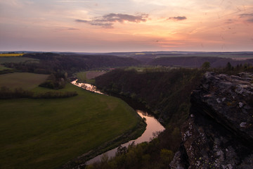 Evening scene from a rock above a river. Very colorful spring view.