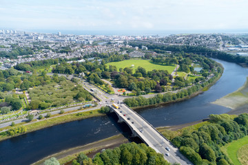 Aerial view of Aberdeen as River Dee flows in a curve to the North Sea showing Duthie Park with...
