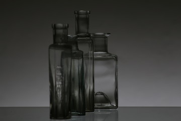Glass bottles on white background in a studio