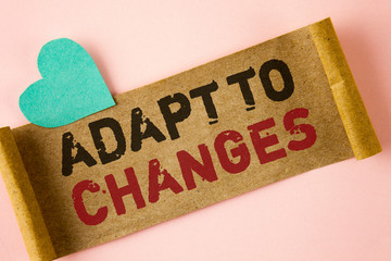 Word writing text Adapt To Changes. Business concept for Innovative changes adaption with technological evolution written Folded Cardboard paper piece plain background Heart next to it.