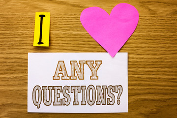 Word writing text Any Questions Question. Business concept for Need to ask something Extra Information Wanted written Sticky Note Paper the wooden background Pink Heart next to it.
