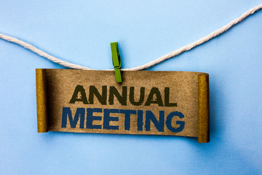 Handwriting text Annual Meeting. Concept meaning Yearly Company Assembly Business Conference Report Event written Cardboard Paper hanging on rope the plain background Clip.