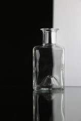 Glass bottles on white background in a studio