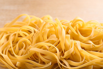 Raw egg noodles, closeup. Traditional Asian meal