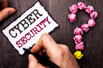 Conceptual hand writing showing Cyber Security. Business photo text Online prevention of attacks Viruses Encrypt Information written by Man Sticky Note Holding Pen Wooden background Ask for
