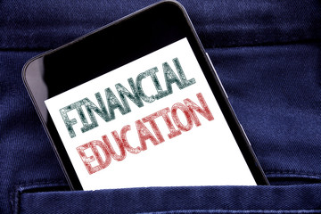 Handwriting Announcement text showing Financial Education. Business concept for Finance Knowledge Written phone mobile phone, cellphone placed in man front jeans pocket.