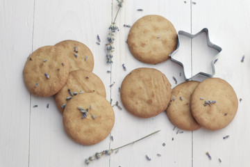 Tasty lavender cookies on light background