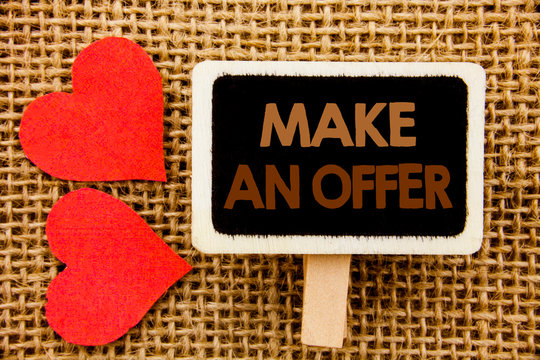 Conceptual hand text showing Make An Offer. Business photo showcasing Settlement Negotiation With Agent Agency Over Home written blackboard the textured background with Love Heart