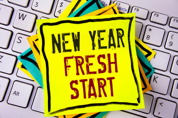 Writing note showing New Year Fresh Start. Business photo showcasing Time to follow resolutions reach out dream job written Yellow Sticky note paper placed White Keyboard. Top view.