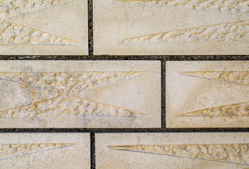 Stone wall cladding close-up. Carved stone wall.