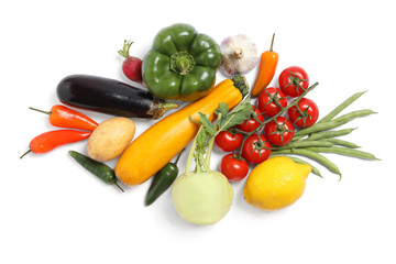 Many different fresh vegetables on white background, top view