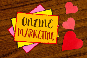 Text sign showing Online Marketing. Conceptual photo Marketing digital advertising social media e-commerce written Sticky note paper wooden background Hearts next to it.