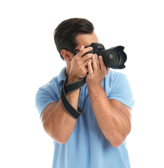 Fototapeta premium Young professional photographer taking picture on white background