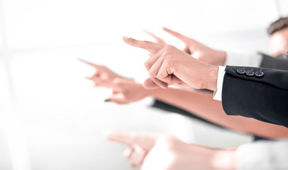 hands of business people pointing to copy space