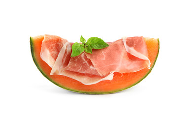 Slice of fresh melon with prosciutto and basil on white background