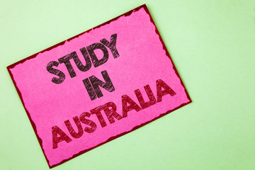 Word writing text Study In Australia. Business concept for Graduate from oversea universities great opportunity written Pink sticky note paper plain background.