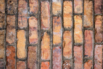Orange worn grunge brick wall surface background weathered dirty distressed texture