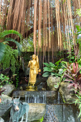 Garden with water features and gilded figures at the steep staircase on the way up to the Wat Saket, the famous Golden Mount in Bangkok