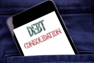 Handwriting Announcement text showing Debt Consolidation. Business concept for Money Loan Credit Written phone mobile phone, cellphone placed in man front jeans pocket.