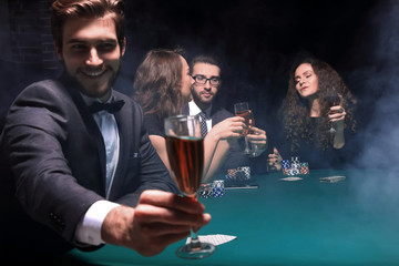 poker player with a glass of wine