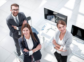 top view. three employees standing in the office