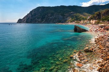 Obraz premium The gulf of Monterosso al Mare, Italy. Monterosso It is one of the five villages in Cinque Terre. Is located at the center of a small natural gulf, protected by a small artificial reef