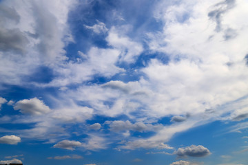 White cumulus clouds against the blue sky, rain clouds, fantastic landscape background, weather,...
