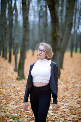 young woman in autumn park