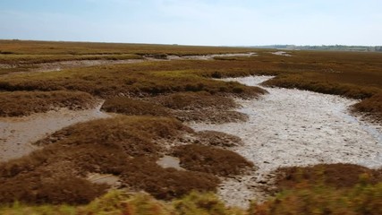Tracking shot of the stunning Ria Formosa lagoon, in The Algarve, Portugal a system of barrier islands connected with the sea