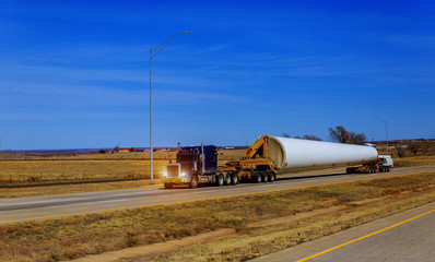 Wind turbines blade on trailer transporting wing the farm
