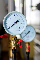 The equipment of the boiler-house, - valves, tubes, pressure gauges, thermometer. Close up of...