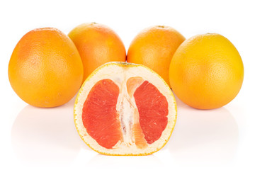 Group of four whole one half of fresh pink grapefruit arranged symmetrically isolated on white background