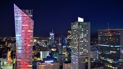 Obraz premium Modern office building at night. Night lights, city office building downtown, cityscape view 