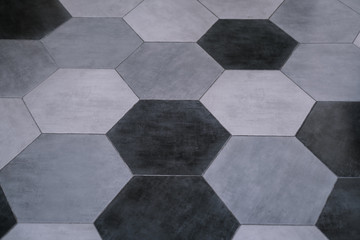 Floor pattern in gray hexagonal tiles