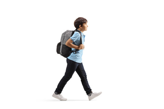 Schoolboy with a backpack walking