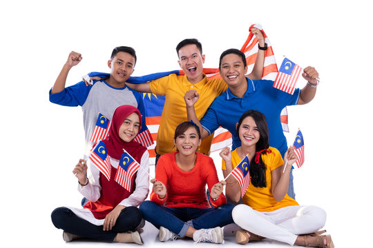 malaysia people holding flag celebrating independence day together