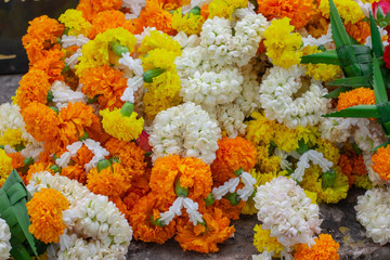 Fresh flower garland made from colorful flowers and fresh leaves.