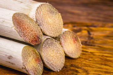 Stalks of sugarcane prepared for producing juice