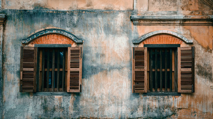 Old cement wall with wood window background.