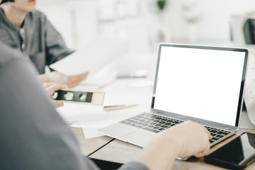 Mockup image of engineers using laptop to drawing design building Project in office, mockup concept