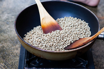 Traditional roasting coffee at home,  freshly roasted coffee beans.