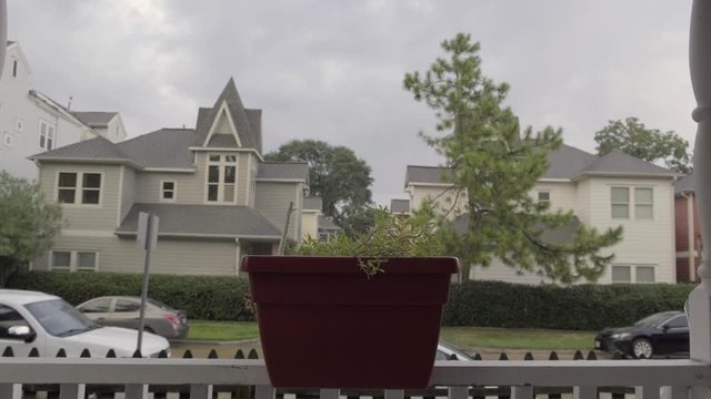 Rain falling in neighborhood over houses
