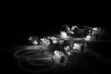 black and white glow trinkets in a dark room