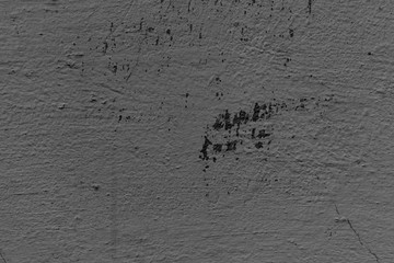 Texture of a concrete wall with cracks and scratches which can be used as a background