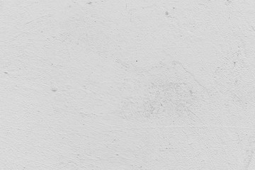 Texture of a concrete wall with cracks and scratches which can be used as a background