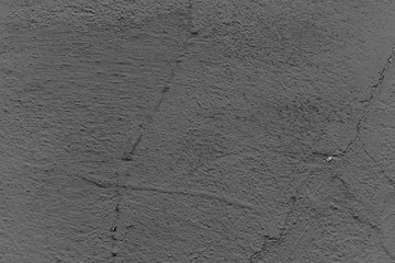Texture of a concrete wall with cracks and scratches which can be used as a background