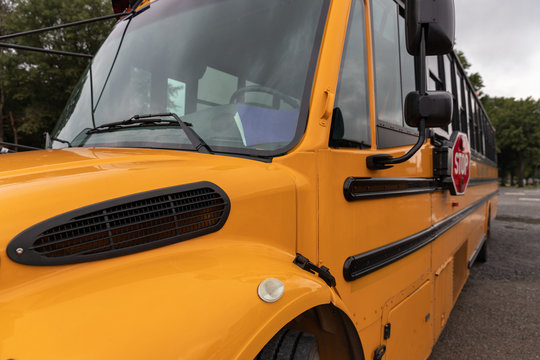 Side view of big yellow school bus used to tranport children safely for education