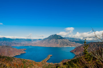Fototapeta premium Aerial photography beautiful Mount Nantai and Lake Chuzenji in autumn season, Nikko, Japan